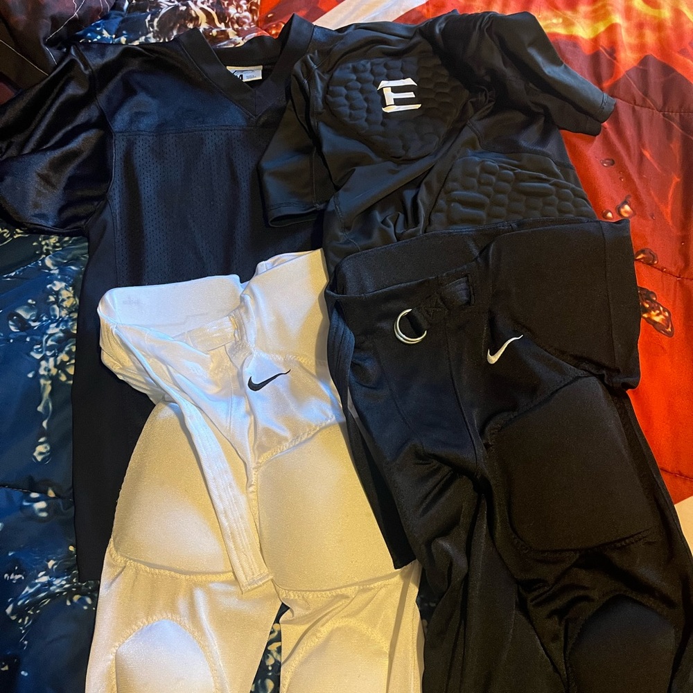 Size medium lot of youth Nike football gear